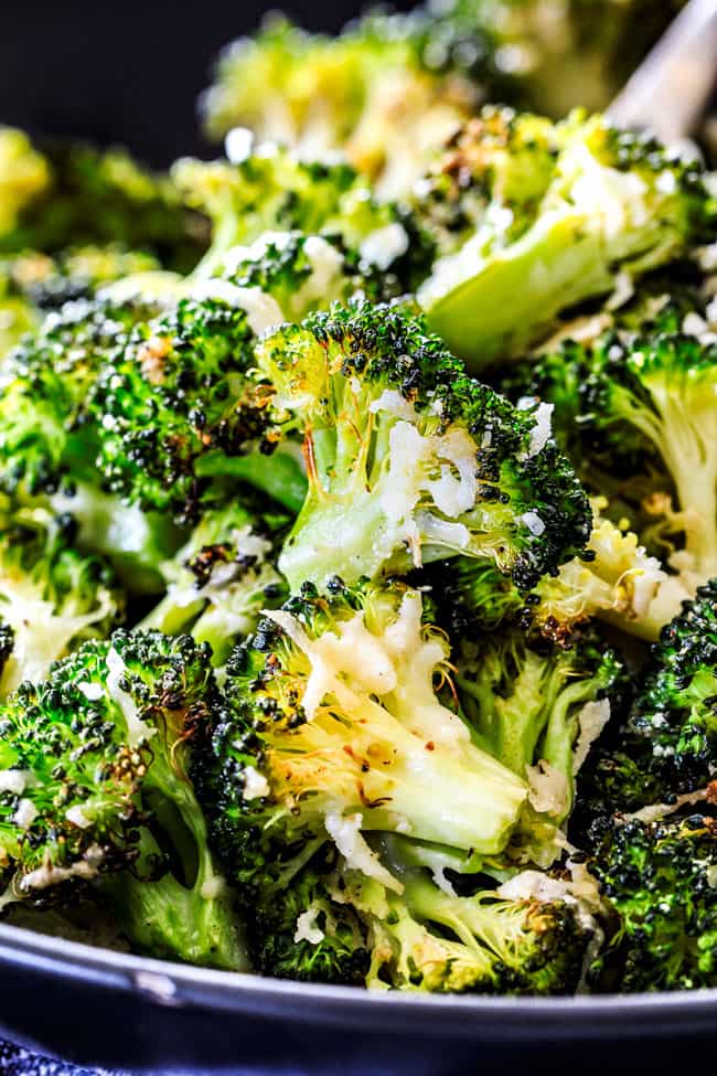 QUICK AND EASY this Parmesan Roasted Broccoli is bursting with flavor, caramelized crispy tops and the quickest side dish to every meal all made in ONE PAN! AKA Minimal effort, HUGE flavor! a bowl of roasted broccoli with parmesan
