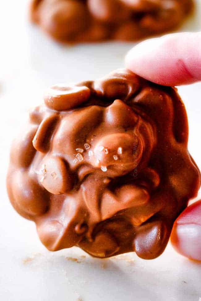 FOOL PROOF Crockpot Chocolate Peanut Clusters are not only crazy delicious but are SO easy! They make the best make ahead, stress free gifts! This post also includes tips and tricks to make them successful every time!