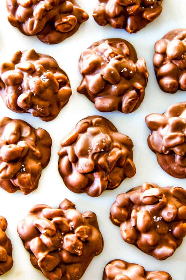FOOL PROOF Crockpot Chocolate Peanut Clusters are not only crazy delicious but are SO easy! They make the best make ahead, stress free gifts! This post also includes tips and tricks to make them successful every time!