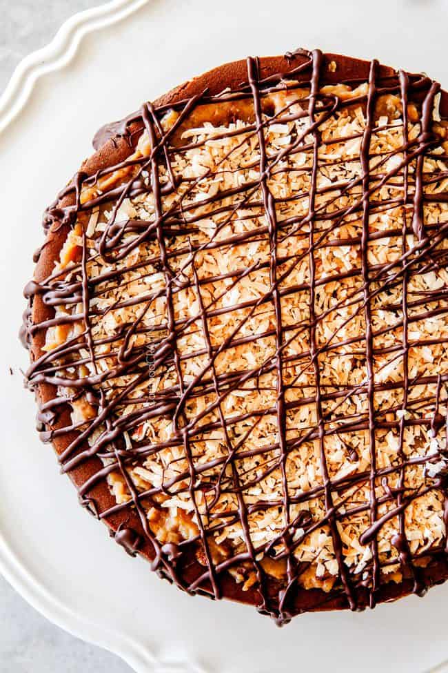 German Chocolate Cheesecake with chocolate drizzle on top.