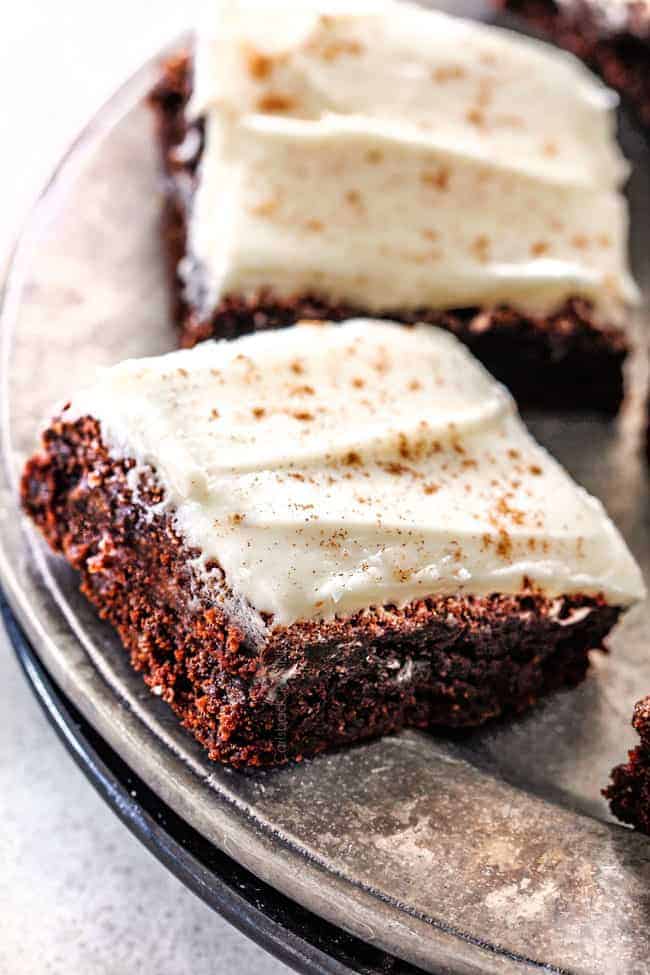 Gingerbread Brownies with Eggnog Frosting on a silver platter. 