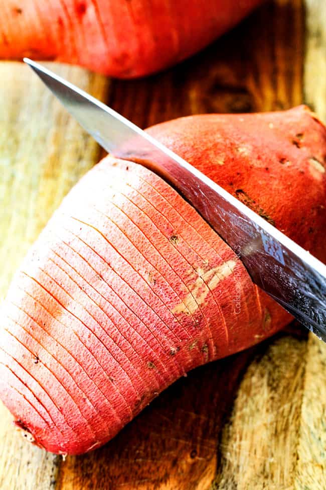These Hasselback Sweet Potatoes are tender, melt-in-your-mouth and bursting with garlic herb, butter flavor! They look wonderfully gourmet for holidays and special occasions but are everyday easy!