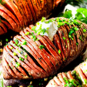 These Hasselback Sweet Potatoes are tender, melt-in-your-mouth and bursting with garlic herb, butter flavor! They look wonderfully gourmet for holidays and special occasions but are everyday easy!