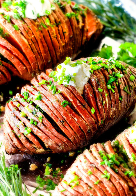 These Hasselback Sweet Potatoes are tender, melt-in-your-mouth and bursting with garlic herb, butter flavor!  They look wonderfully gourmet for holidays and special occasions but are everyday easy! 
