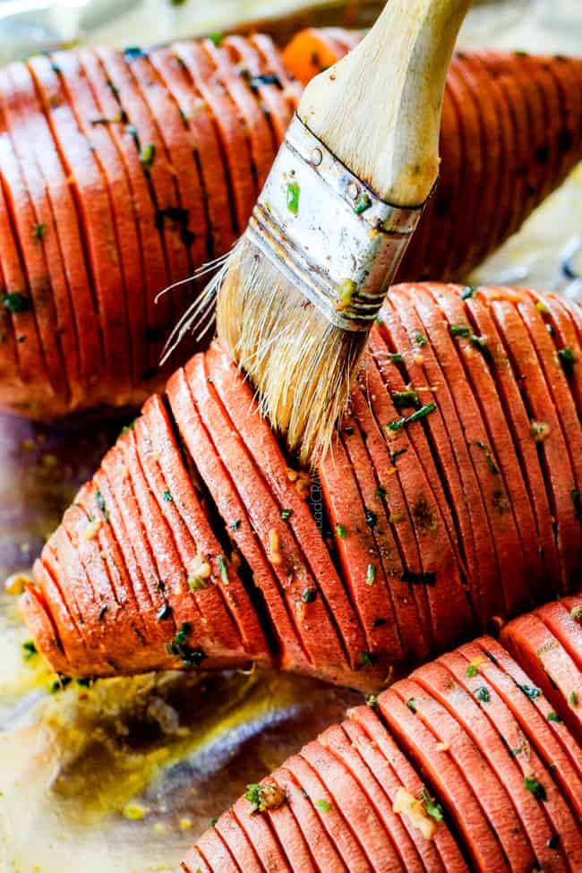 These Hasselback Sweet Potatoes are tender, melt-in-your-mouth and bursting with garlic herb, butter flavor! They look wonderfully gourmet for holidays and special occasions but are everyday easy!