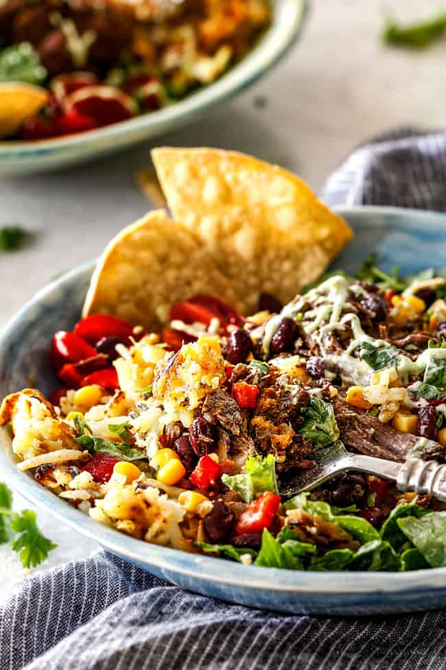 Barbacoa Beef Taco Bowls with Hash Browns & Avocado Ranch serving with a fork.