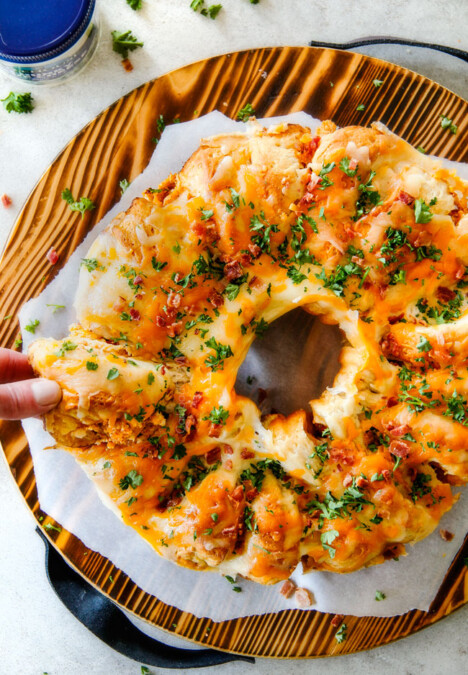 Mega flavorful Buffalo Chicken Dip Ring is your favorite decadent creamy, cheesy dip baked right into a buttery biscuit ring! Crazy delicious EASY crowd pleasing appetizer perfect for parties or game day!  It may look super impressive but you won’t believe how easy it is!