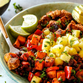 30 Minute Cajun Chicken Bowls bursting with avocados, black beans, sweet potatoes and pineapple! These are spicy, fresh, healthy and ADDICTING!