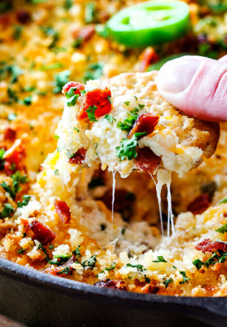 This quick and easy Jalapeno Popper Dip recipe tastes like your favorite appetizer in EASY, warm, creamy, cheesy addicting dip form! It is my go-to party appetizer that everyone LOVES!!!Â