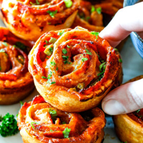 These Pizza Pinwheels are super easy to make, customizable, freeze beautifully, and absolutely irresistible for snacks, appetizers or fun meals! You friends and family will beg you to make these!