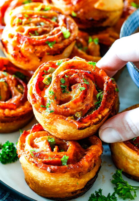 These Pizza Pinwheels are super easy to make, customizable, freeze beautifully, and absolutely irresistible for snacks, appetizers or fun meals! You friends and family will beg you to make these!