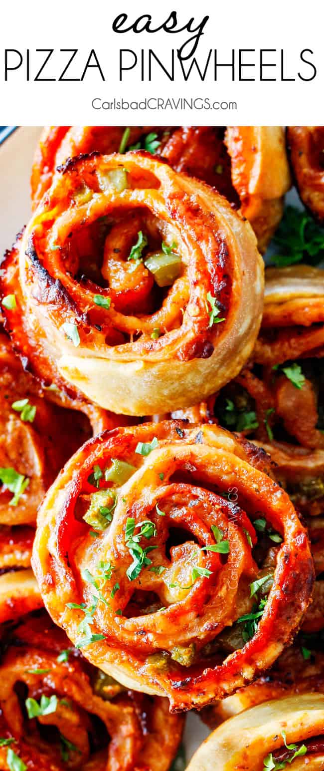 These Pizza Pinwheels are super easy to make, customizable, freeze beautifully, and absolutely irresistible for snacks, appetizers or fun meals! You friends and family will beg you to make these! up close top view of pizza pinwheels with pepperoni