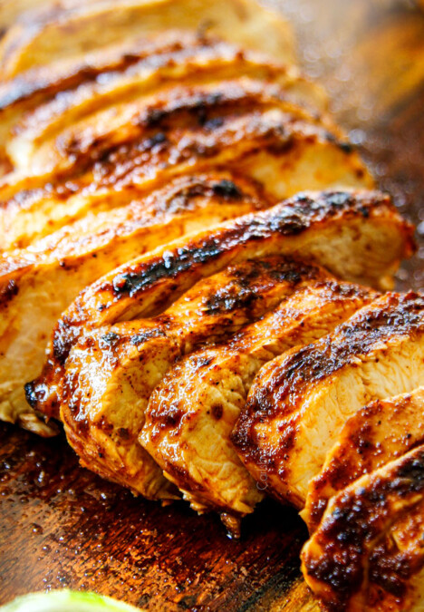 showing how to make pineapple chicken tacos by grilling the chicken