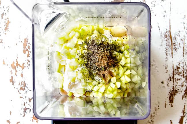 showing how to make Greek chicken Salad by adding Greek Dressing ingredients to a blender