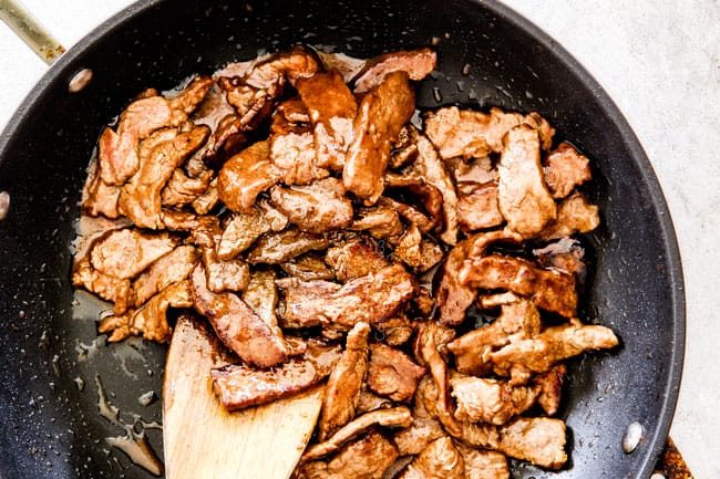 showing how to make Mongolian Beef by stir frying beef with sauce