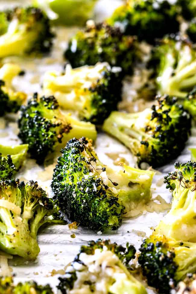 QUICK AND EASY this Parmesan Roasted Broccoli is bursting with flavor, caramelized crispy tops and the quickest side dish to every meal all made in ONE PAN! AKA Minimal effort, HUGE flavor! showing how to make oven roasted broccoli by spreading broccoli in an even layer on a baking sheet