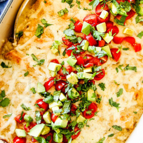 These are the BEST Green Chile Chicken Enchiladas I have ever had!!! They are easy to make, satisfyingly rich, cheesy, creamy and saucy - no dry chicken enchiladas here! And the homemade green chile sour cream white sauce is out of this world!