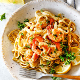 20 MINUTE Lemon Garlic Shrimp Fettuccine is wonderfully creamy, bursting with flavor and so easy! The most gourmet tasting dinner you can make in under 30 minutes!