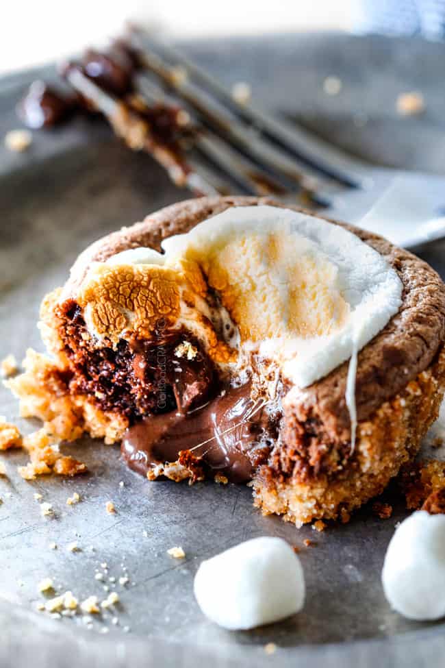 EASY - 30 Minute - S'mores Molten Lava Pies are decadently rich, with an oozing chocolate center, topped with melty toasted marshmallows all nestled in a buttery graham cracker crust - BUT - they are super easy to make and baked in a muffin tin so no special equipment is required!