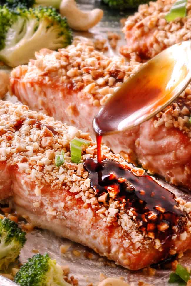 Honey Soy Salmon crusted in cashews with Honey Soy Glaze being drizzled on top