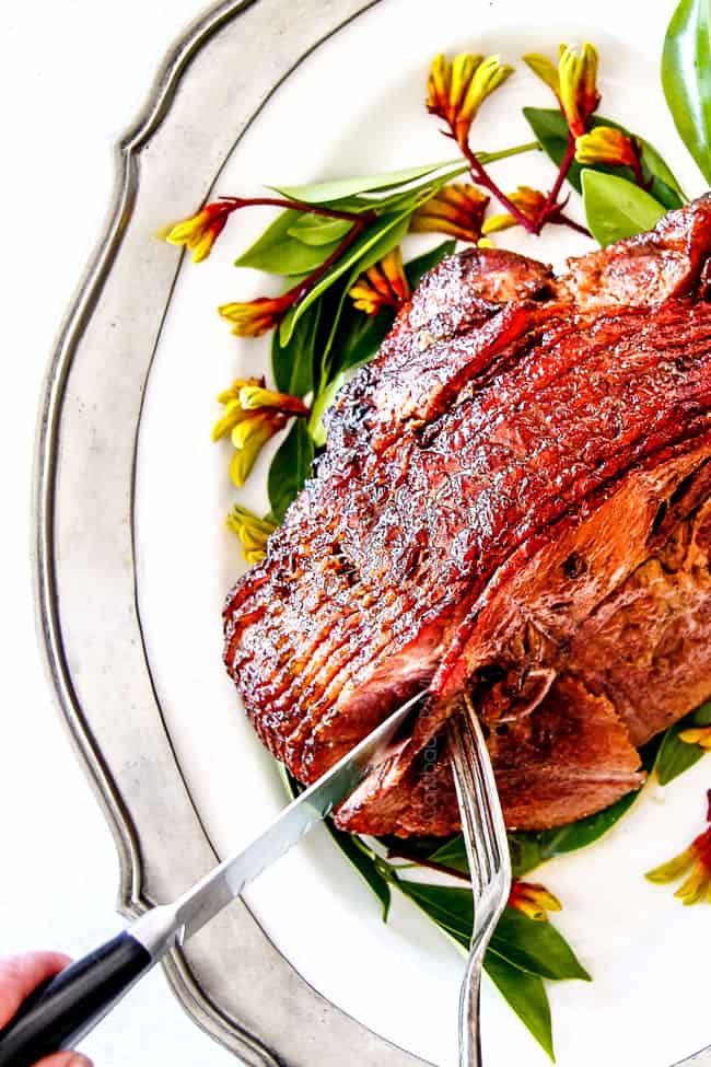 up close shot of baked Ham with brown sugar glaze for ham on a white platter