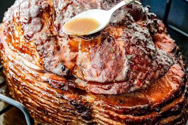 Showing how to Cook a Precooked Ham by spooning juices over Brown Sugar Glaze for Ham after ham surface is caramelized