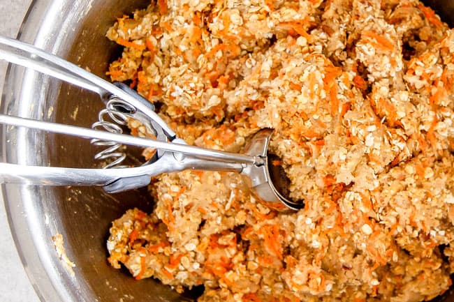 Showing How to make Carrot Cake Cookies by scooping Carrot Cake Cookie Dough onto nonstick mats