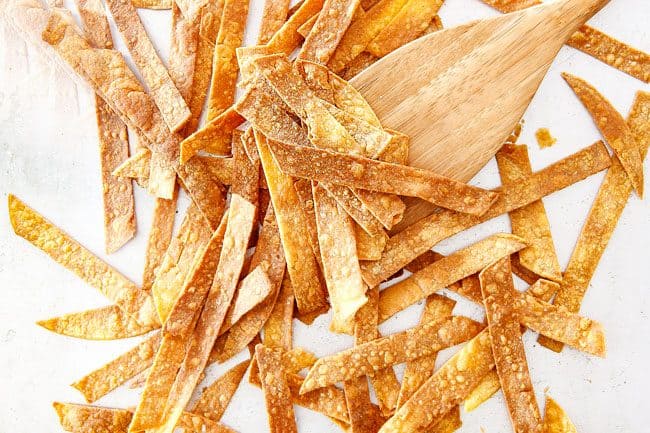 Showing How to Make Tortilla Strips for Crockpot Chicken Tortilla Soup by baking on baking sheet until golden