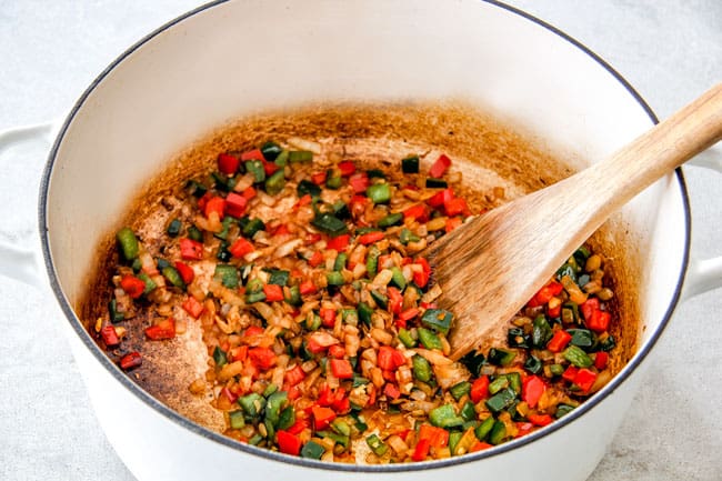 Easy 30-Minute Homemade Chicken Tortilla Soup that tastes better than any restaurant! It's accidentally healthy, easy to double/triple for a crowd, freezer friendly and tastes like it's been simmering for hours but on your table in 30 Minutes! Showing How to Make Chicken Tortilla Soup by sauteinig onions, garlic, red bell peppers, poblano peppers and onions