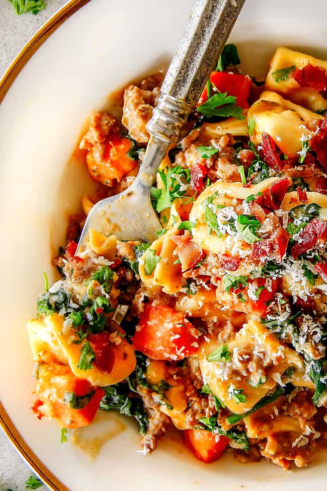 Top view of Creamy Tortellini recipe with Italian sausage, spinach, sweet potatoes, bacon and Parmesan