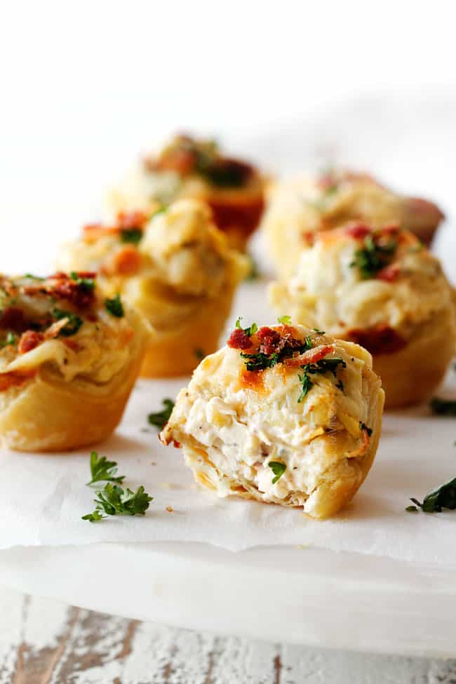 artichoke dip bite with bite taken out of it