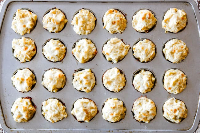 Baked Artichoke Dip Bites in muffin tin coming out of oven