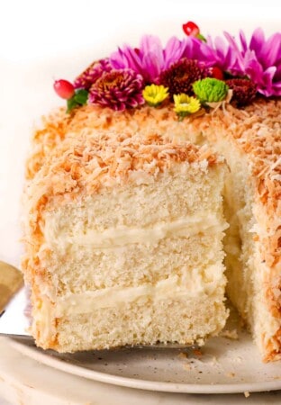 up close of a slice of coconut cake recipe showing how soft and fluffy it is