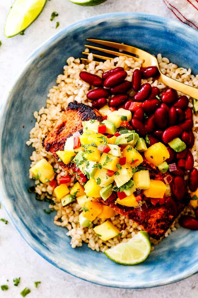top view of cajun salmon with pineapple salsa, red beans and rice
