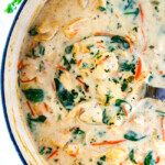 top view of Olive Garden Chicken Gnocchi Soup with matchstick carrots, shredded rotisserie chicken