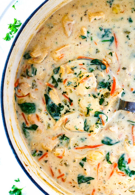 top view of Olive Garden Chicken Gnocchi Soup with matchstick carrots, shredded rotisserie chicken