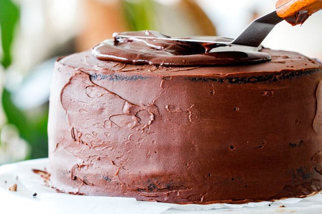 frosting moist Chocolate Raspberry Cake with ganache