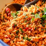 authentic Mexican rice with fire roasted tomatoes in a blue skillet