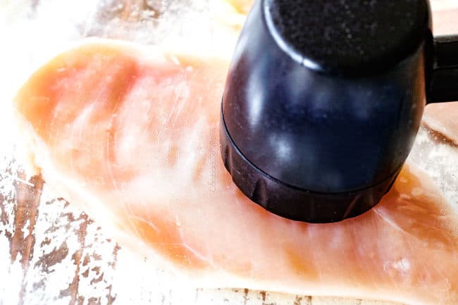 showing how to make Bruschetta Chicken by pounding chicken thin in between two pieces of plastic with a meat mallet