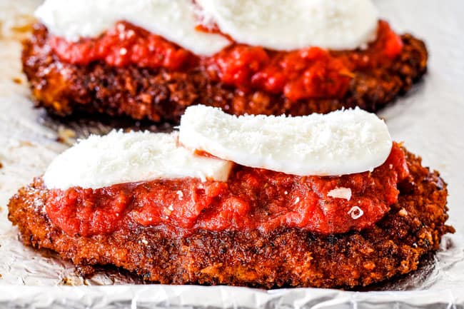 showing how to make chicken Parmesan by layering fried chicken with tomato sauce, mozzarella and Parmesan