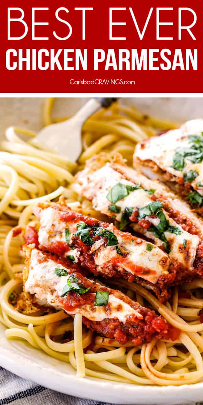 up close of view of slices of baked chicken Parmesan with mozzarella cheese, Parmesan and fresh basil.