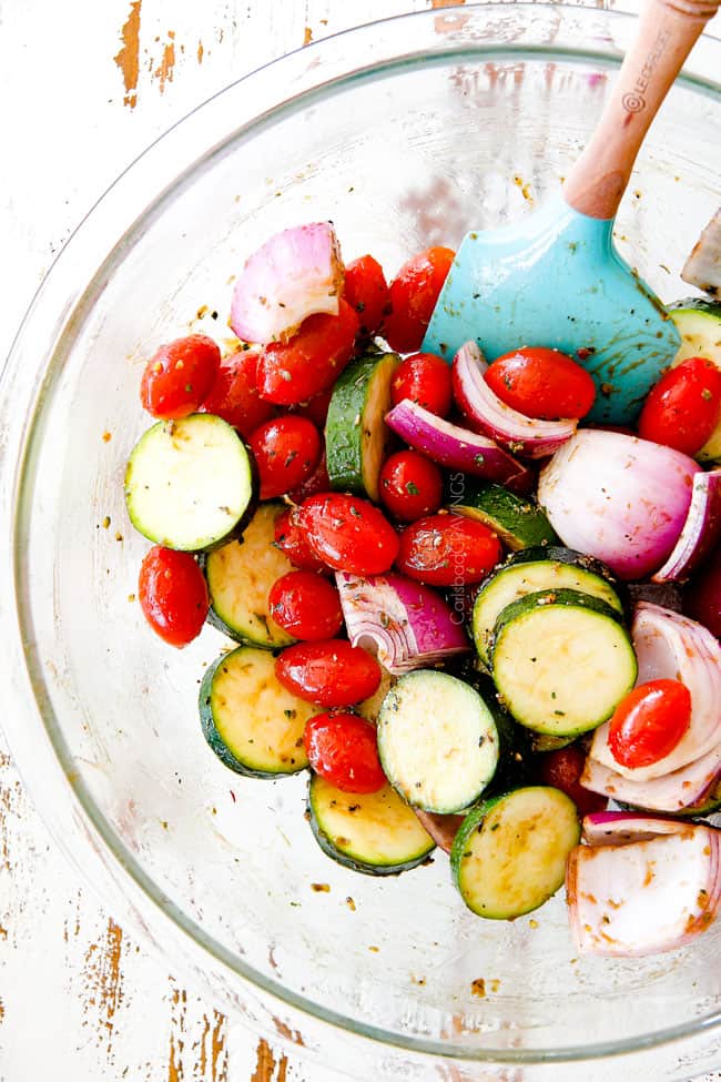 tomatoes, zucchini, onions in a glass bowl to make chicken souvlaki