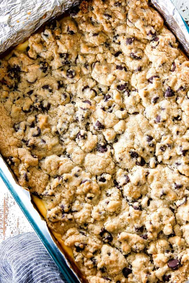 top view of Chocolate Chip Cheesecake Bars in a glass 9x13 pan
