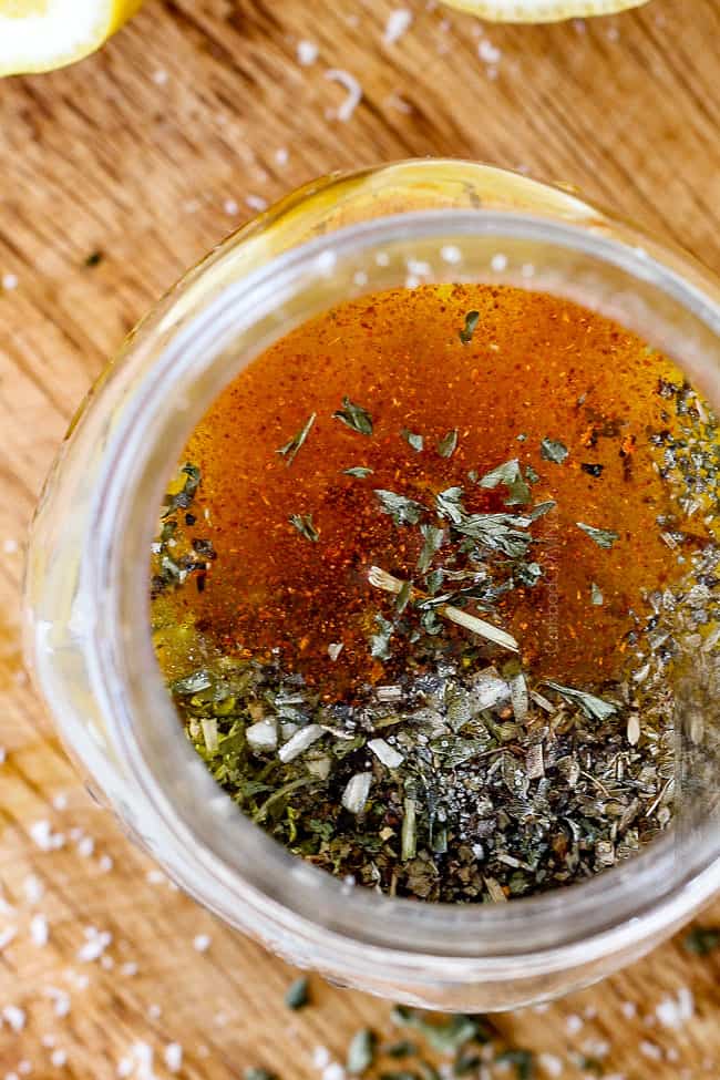 top view of Homemade Italian Dressing with dried parsley and basil on top