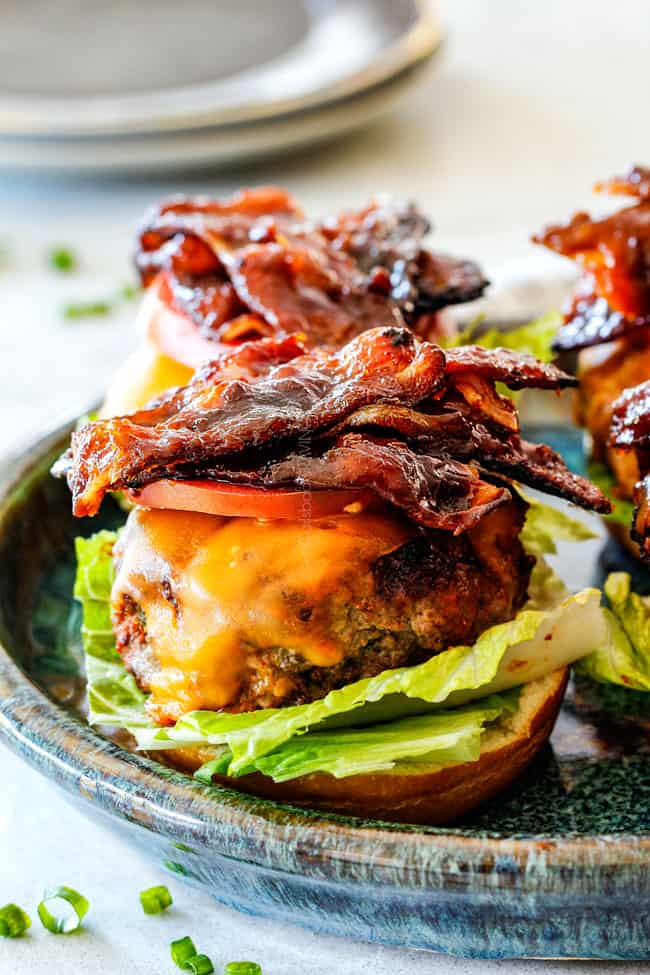 cheeseburger with bacon, lettuce and tomatoes open faced