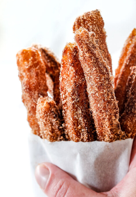easy churros in a white bag standing straight up