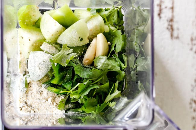 showing how to make creamy Cilantro Lime Dressing by adding tomatillos, cilantro, garlic, ranch seasoning, lime juice to a blender