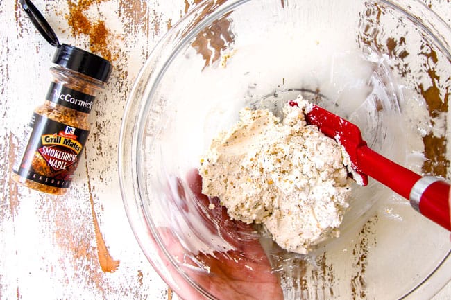 mixing goat cheese in a glass bowl for Strawberry Goat Cheese Bruschtta