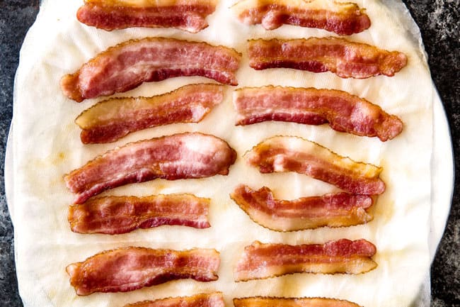 showing how to make bacon wrapped shrimp by cooking shrimp on paper towels in the micorwave