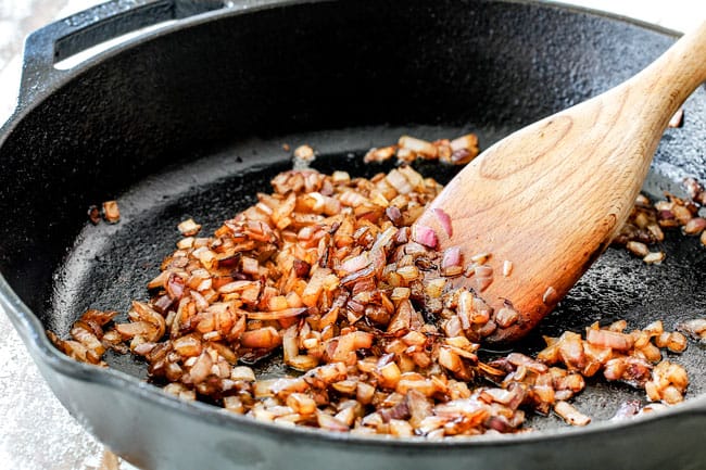 Showing How to make Homemade Baked Beans by cooking onions and garlic in a skillet
